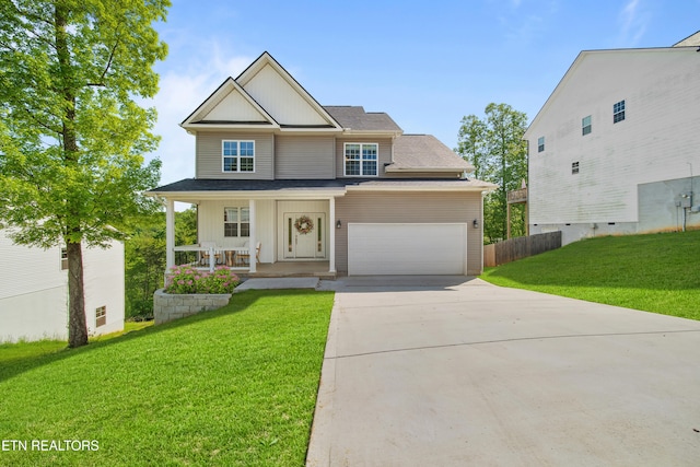 3966 Mountain Vista Rd, Knoxville, TN 37931 - view of front facade with covered porch, concrete driveway, a garage, roof with shingles, and board and batten siding