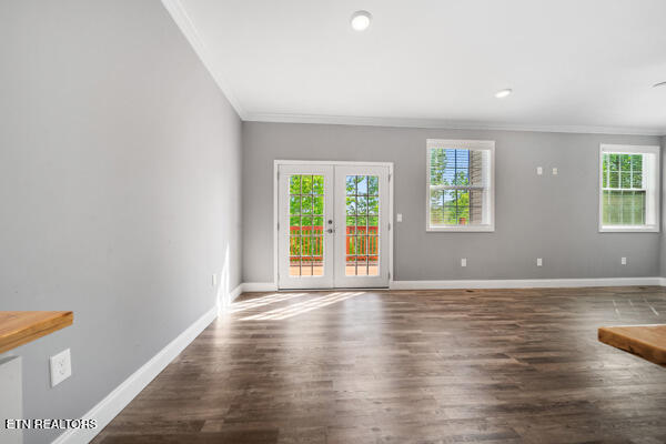 3966 Mountain Vista Rd, Knoxville, TN 37931 - unfurnished living room with ornamental molding, healthy amount of natural light, baseboards, wood finished floors, and french doors