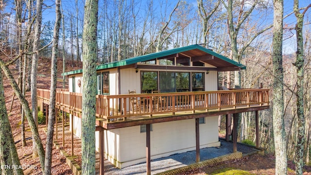 rear view of house with a wooden deck