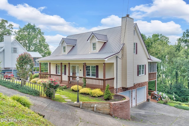 4820 Edens View Rd, Kingsport, TN 37664 - view of front of property featuring covered porch, driveway, an attached garage, a chimney, and a metal roof