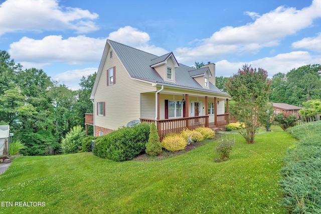 4820 Edens View Rd, Kingsport, TN 37664 - view of side of property featuring a lawn, covered porch, a metal roof, and a chimney