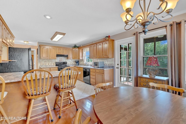 4820 Edens View Rd, Kingsport, TN 37664 - kitchen featuring black appliances, crown molding, light countertops, tasteful backsplash, and a chandelier