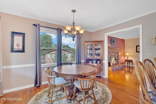4820 Edens View Rd, Kingsport, TN 37664 - dining room featuring light wood-type flooring, a chandelier, and ornamental molding