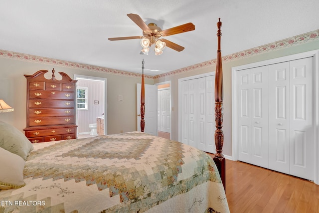 4820 Edens View Rd, Kingsport, TN 37664 - bedroom with wood finished floors, two closets, and a ceiling fan