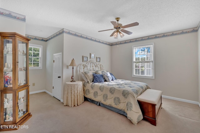 4820 Edens View Rd, Kingsport, TN 37664 - bedroom with light colored carpet, a textured ceiling, and ceiling fan