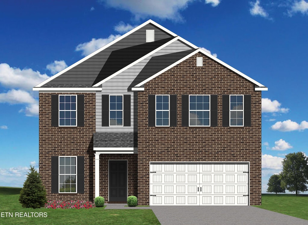 traditional-style house with brick siding, a front lawn, driveway, and an attached garage