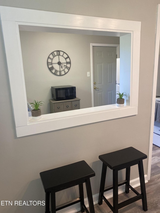 2010 Fine Ave, Knoxville, TN 37917 - detailed view of black microwave, wood finished floors, and baseboards