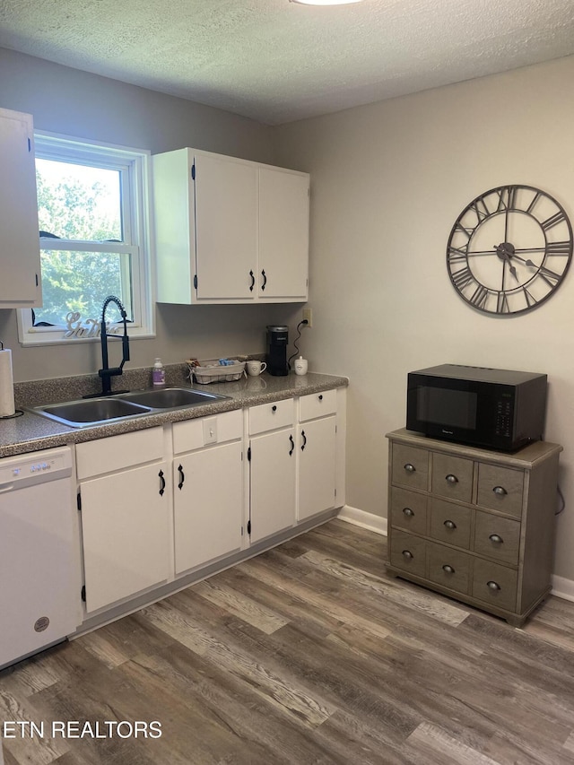 2010 Fine Ave, Knoxville, TN 37917 - kitchen featuring black microwave, dishwasher, a sink, white cabinets, and a textured ceiling