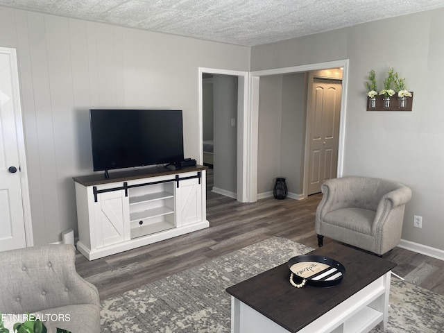 2010 Fine Ave, Knoxville, TN 37917 - living room featuring dark wood finished floors, baseboards, and a textured ceiling