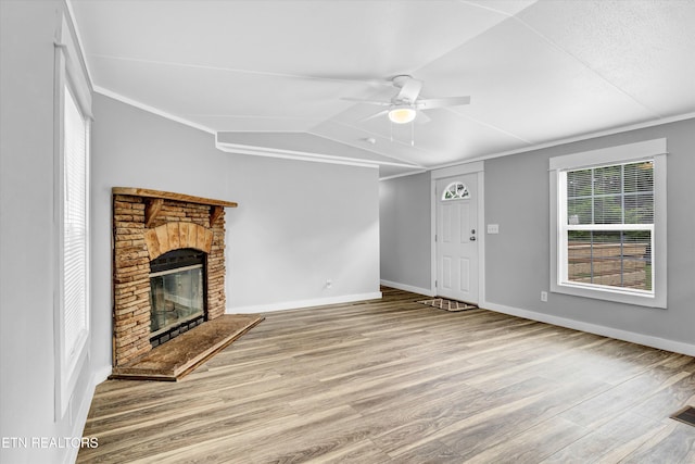 180 County Rd 853, Delano, TN 37325 - unfurnished living room with ceiling fan, wood finished floors, vaulted ceiling, a stone fireplace, and baseboards