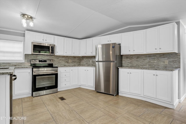 180 County Rd 853, Delano, TN 37325 - kitchen featuring stainless steel appliances, vaulted ceiling, white cabinetry, backsplash, and light stone countertops