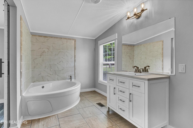 180 County Rd 853, Delano, TN 37325 - full bath featuring vanity, a bathtub, vaulted ceiling, baseboards, and a textured ceiling