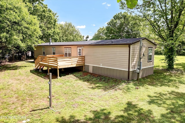 180 County Rd 853, Delano, TN 37325 - back of property featuring a deck, a lawn, and view of scattered trees