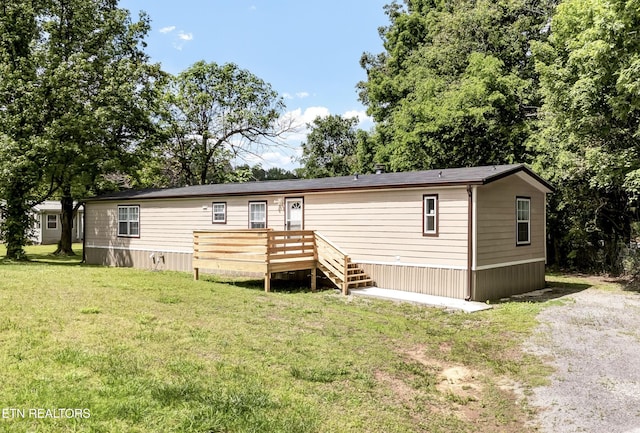 180 County Rd 853, Delano, TN 37325 - manufactured / mobile home with a wooden deck and a front lawn