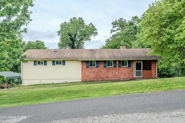 view of front of home with a chimney and a front yard