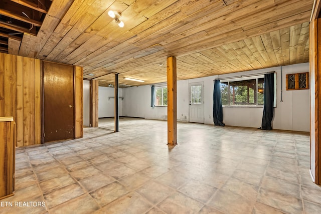 basement featuring wooden ceiling and plenty of natural light