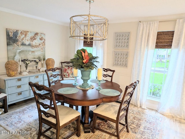 131 Chestnut Hill Rd, Oak Ridge, TN 37830 - dining area with healthy amount of natural light, a chandelier, ornamental molding, and light wood-style floors