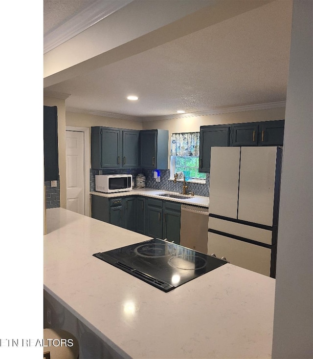 131 Chestnut Hill Rd, Oak Ridge, TN 37830 - kitchen with white appliances, a sink, crown molding, backsplash, and recessed lighting