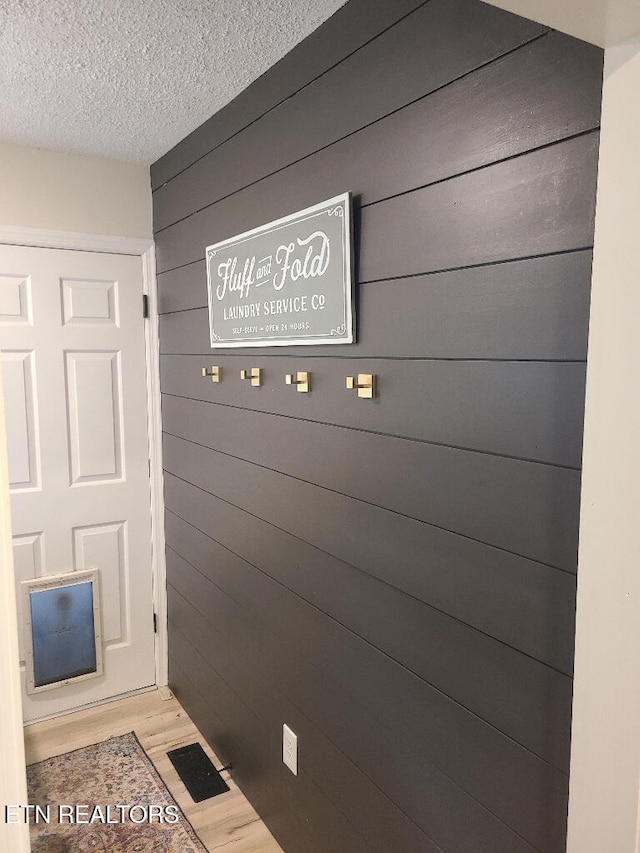131 Chestnut Hill Rd, Oak Ridge, TN 37830 - detailed view of a textured ceiling, wood finished floors, and wood walls