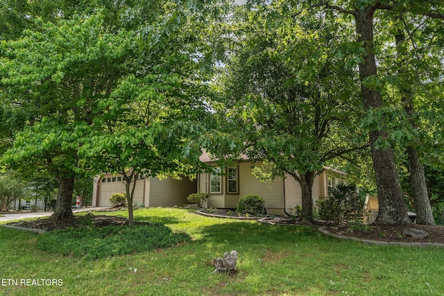 122 Mariners Dr, Crossville, TN 38558 - obstructed view of property with a garage, driveway, and a front yard