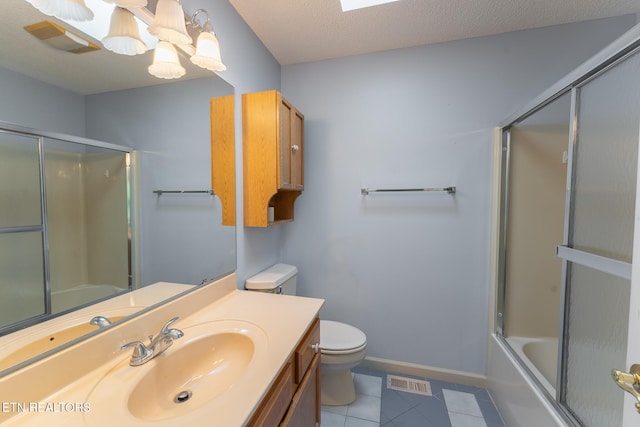 122 Mariners Dr, Crossville, TN 38558 - full bathroom with toilet, vanity, tile patterned flooring, combined bath / shower with glass door, and a chandelier