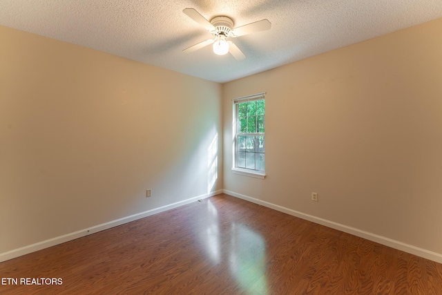 122 Mariners Dr, Crossville, TN 38558 - empty room featuring dark wood-style flooring, a ceiling fan, a textured ceiling, and baseboards