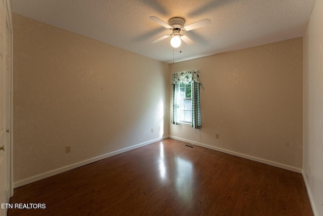 122 Mariners Dr, Crossville, TN 38558 - empty room with a ceiling fan, wood finished floors, a textured ceiling, and baseboards