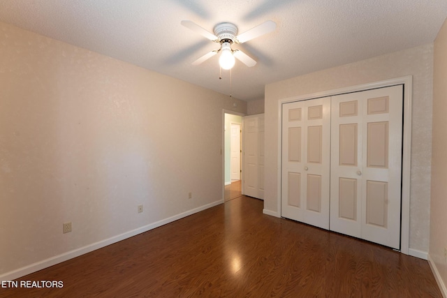 122 Mariners Dr, Crossville, TN 38558 - unfurnished bedroom featuring dark wood-style flooring, baseboards, a closet, and a ceiling fan