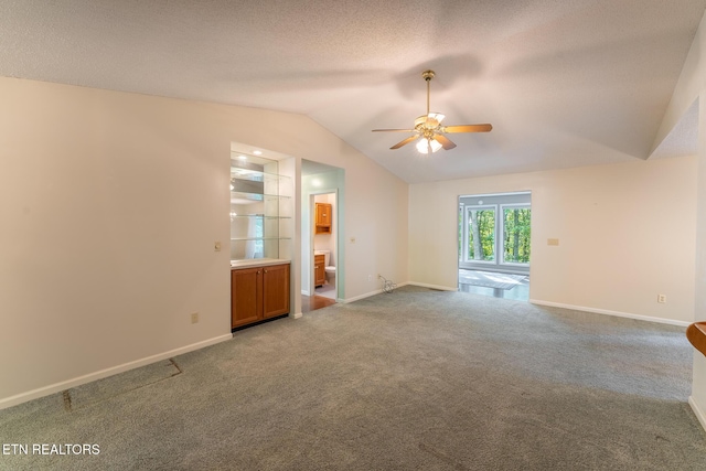 122 Mariners Dr, Crossville, TN 38558 - spare room featuring a ceiling fan, vaulted ceiling, carpet flooring, and baseboards