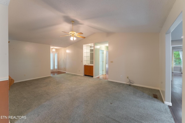 122 Mariners Dr, Crossville, TN 38558 - carpeted empty room featuring a ceiling fan, vaulted ceiling, baseboards, and a textured ceiling