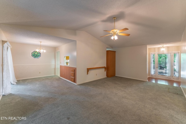122 Mariners Dr, Crossville, TN 38558 - unfurnished living room with carpet flooring, a chandelier, vaulted ceiling, ceiling fan, and a textured ceiling