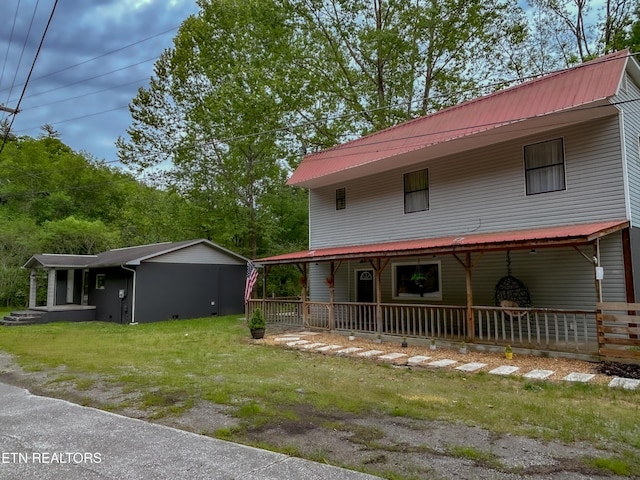 643 Airport Rd, Oakdale, TN 37829 - view of front of house featuring covered porch, metal roof, and a front yard