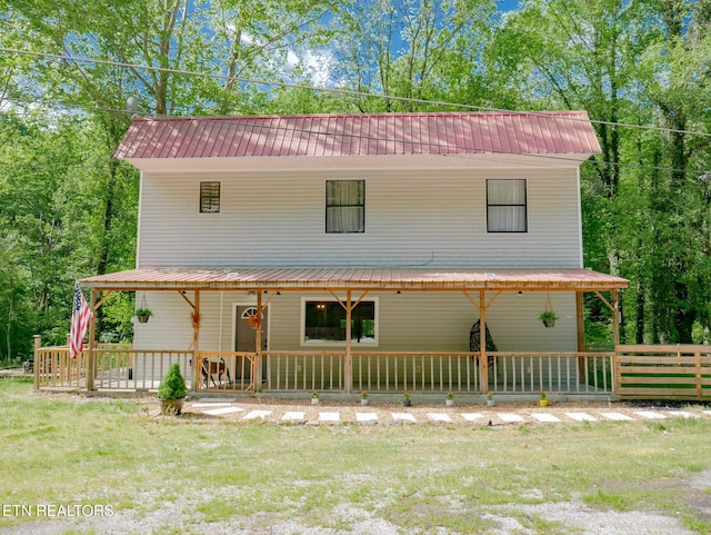643 Airport Rd, Oakdale, TN 37829 - farmhouse featuring metal roof, a porch, and a front yard