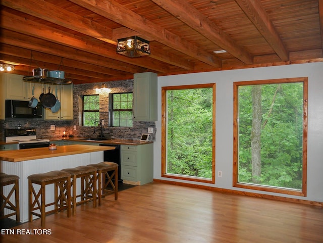 643 Airport Rd, Oakdale, TN 37829 - kitchen featuring black appliances, a sink, tasteful backsplash, butcher block countertops, and beam ceiling