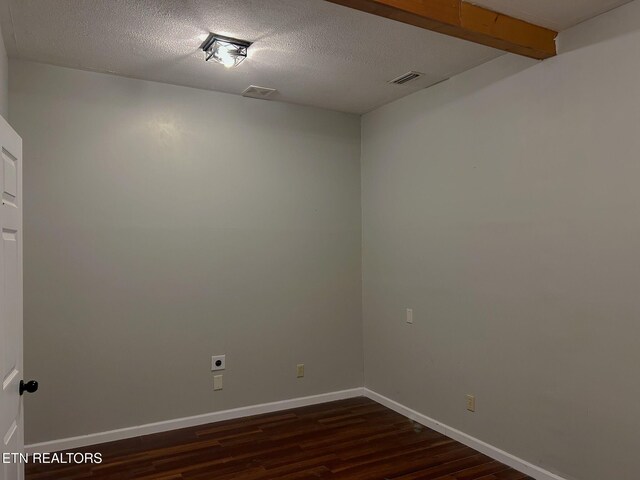 643 Airport Rd, Oakdale, TN 37829 - spare room with dark wood-style floors, baseboards, and a textured ceiling