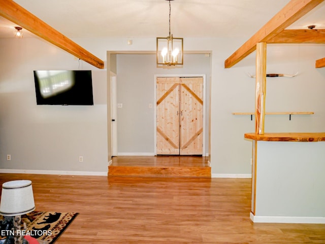 643 Airport Rd, Oakdale, TN 37829 - foyer entrance with light wood-style floors, a chandelier, baseboards, and beam ceiling