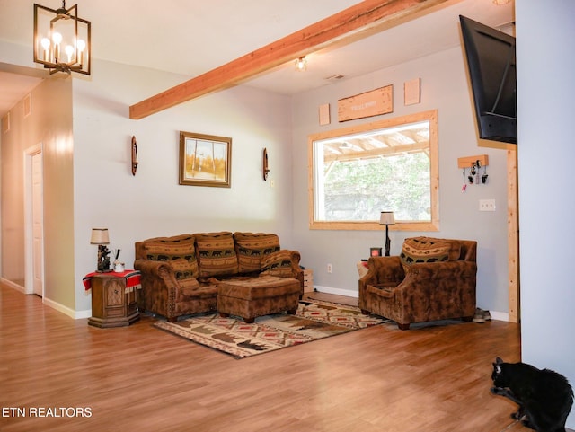 643 Airport Rd, Oakdale, TN 37829 - living area featuring wood finished floors, beamed ceiling, baseboards, and a chandelier