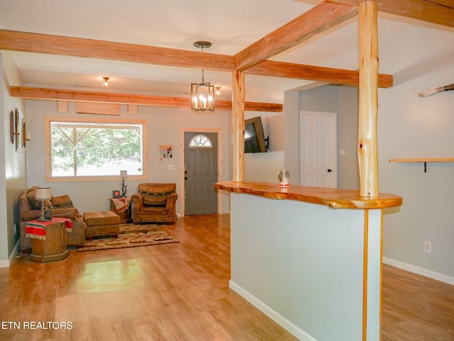 643 Airport Rd, Oakdale, TN 37829 - living area with beam ceiling, light wood-type flooring, baseboards, and a chandelier