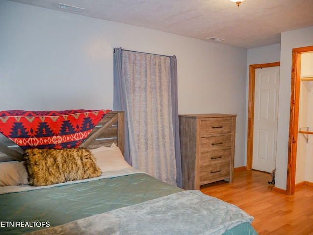 643 Airport Rd, Oakdale, TN 37829 - bedroom with light wood-style flooring and baseboards