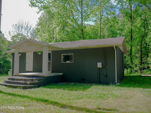 643 Airport Rd, Oakdale, TN 37829 - rear view of property featuring a lawn