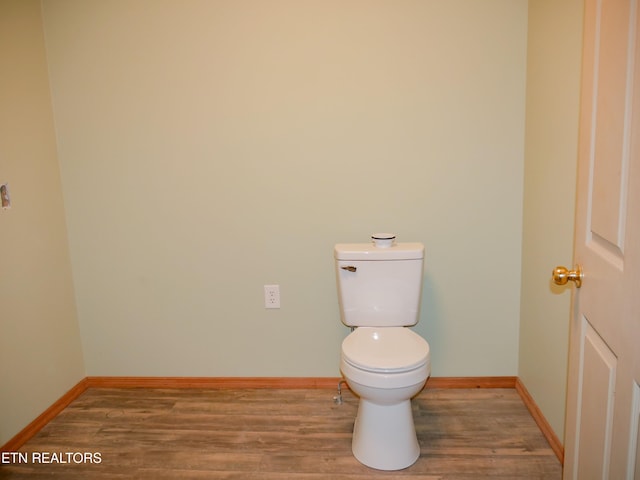 643 Airport Rd, Oakdale, TN 37829 - bathroom with wood finished floors, baseboards, and toilet