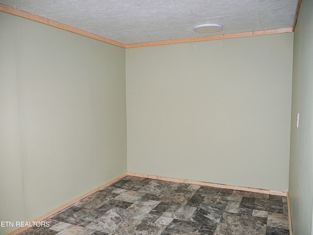 643 Airport Rd, Oakdale, TN 37829 - empty room with dark stone finish flooring and baseboards