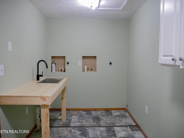 643 Airport Rd, Oakdale, TN 37829 - laundry area with electric dryer hookup, washer hookup, cabinet space, and baseboards