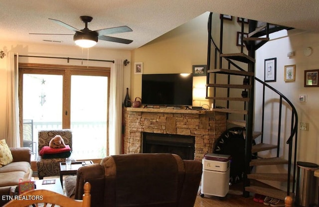 281 Moytoy Rd Unit 206, Crab Orchard, TN 37723 - living room featuring healthy amount of natural light, stairs, dark wood-style floors, and a textured ceiling