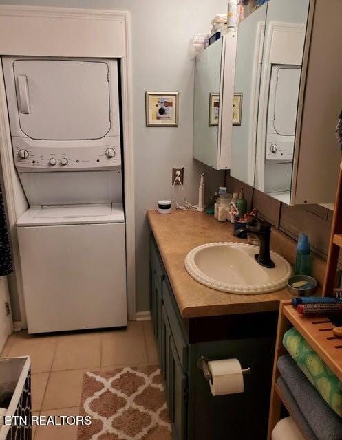 281 Moytoy Rd Unit 206, Crab Orchard, TN 37723 - bathroom featuring stacked washing machine and dryer, tile patterned flooring, and vanity