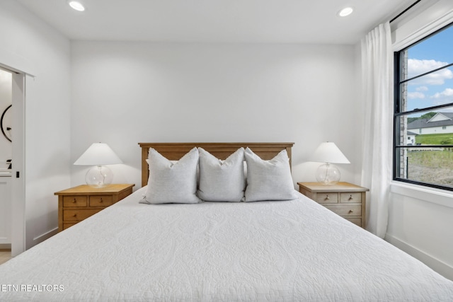 bedroom with recessed lighting and baseboards