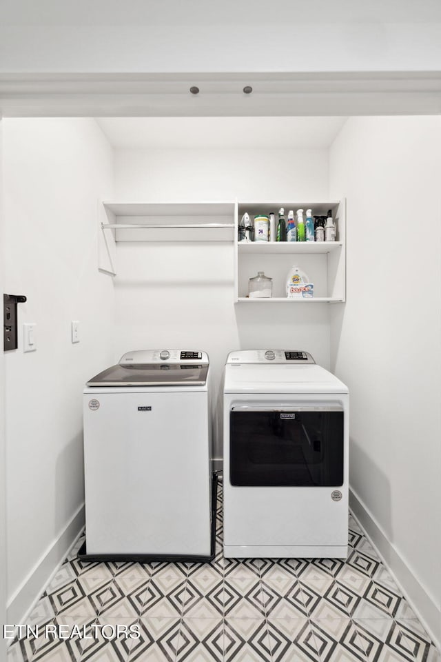 washroom with separate washer and dryer, baseboards, and light flooring