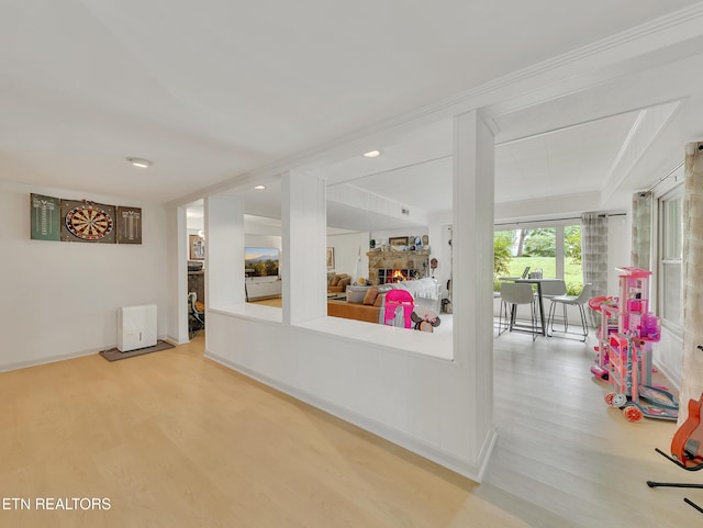 hall with wood finished floors and baseboards