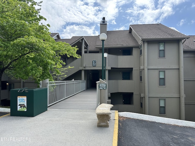 view of building exterior with fence