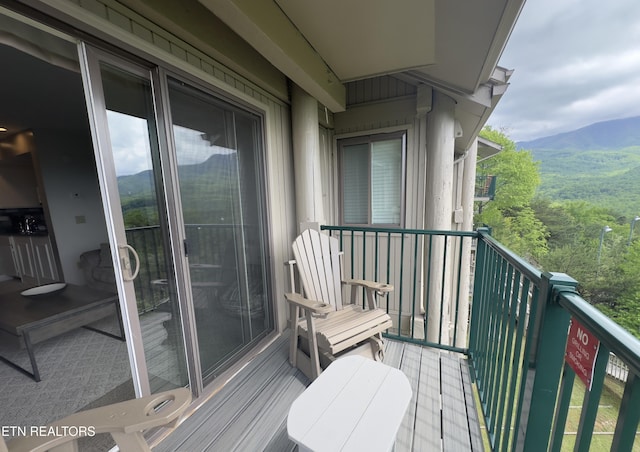 balcony featuring a mountain view